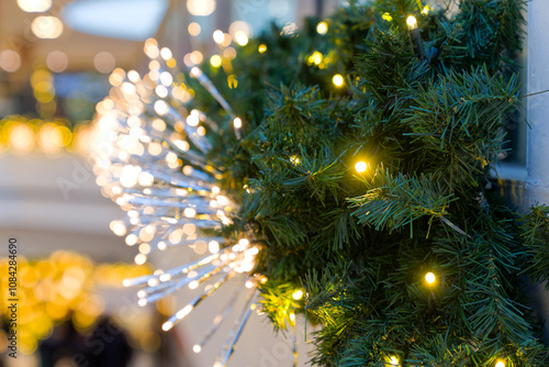 Christmas decoration with Christmas tree branches and Christmas lights indoors of Glatt shopping center at Swiss City of Wallisellen. Photo taken November 16th, 2024, Zurich Walllisellen, Switzerland.