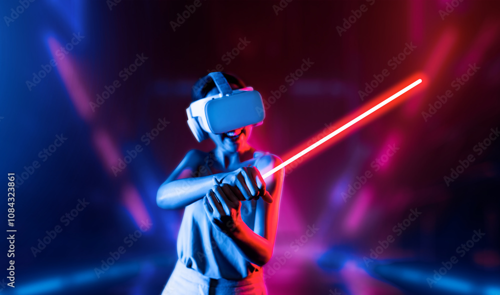 Naklejka premium Smart female standing wearing VR headset connecting metaverse, future cyberspace community technology. Elegant woman firmly holding laser saber seriously while play sword-fighting game. Hallucination.