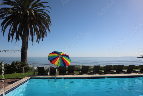 Tranquil pool on the ocean with umbrella
