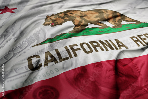 waving colorful california state flag on the dollar money background. finance concept.