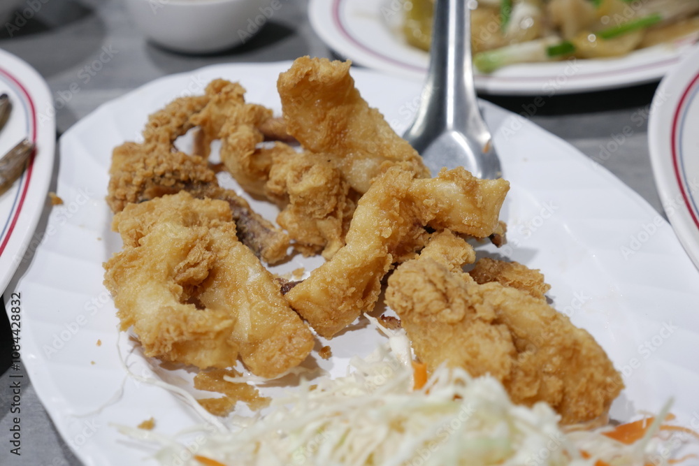 Fried fish delicacy local eatery food dish urban setting close-up view culinary experience Fried fish delicacy local eatery food dish urban setting close-up view culinary experience