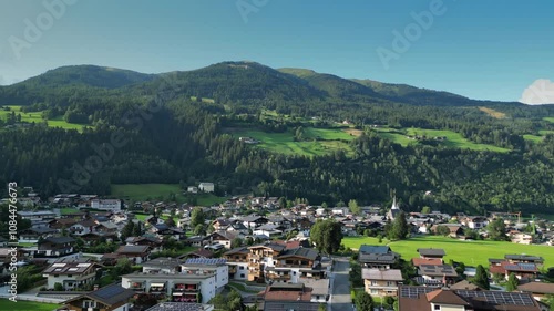 Aerial video of a valley in Austrian Alps, buildings and nature