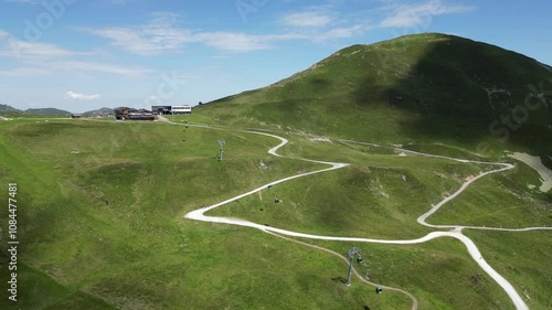 Aerial video of a valley in Austrian Alps, buildings and nature