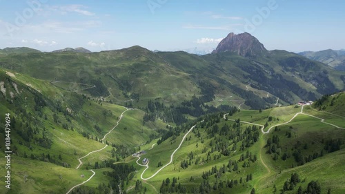 Aerial video of a valley in Austrian Alps, buildings and nature