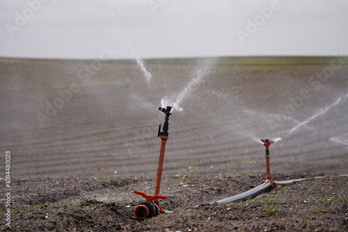 agricultural field with sprinklers