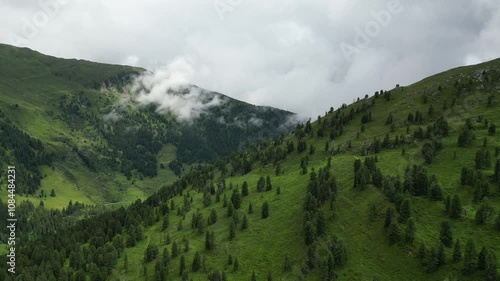 Aerial video of a valley in Austrian Alps, buildings and nature