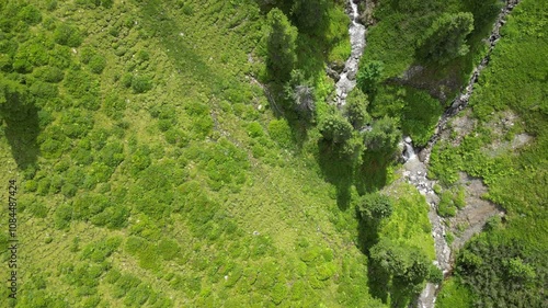 Aerial video of a valley in Austrian Alps, buildings and nature