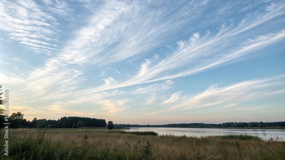 Delicate wisps of cloud drift across a pale blue sky, cloudy sky, gentle cloud movement, pale blue background, light and airy feel, dreamy landscape Delicate wisps of cloud drift across a pale blue sky, cloudy sky, gentle cloud movement, pale blue background, light and airy feel, dreamy landscape