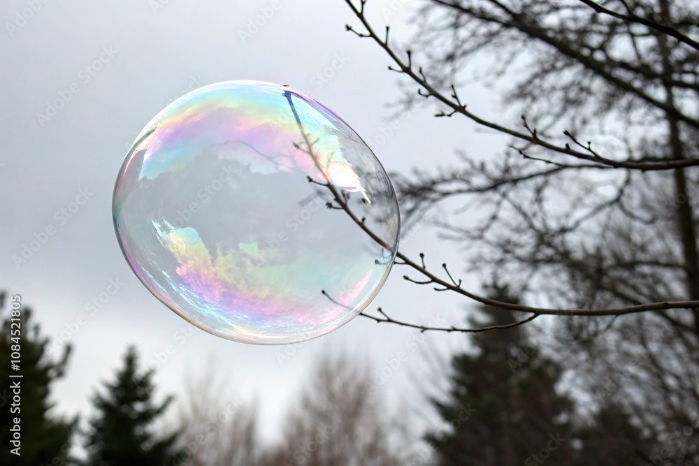 Iridescent soap bubble suspended in mid-air, shimmering, vibrant, shimmering, colorful Iridescent soap bubble suspended in mid-air, shimmering, vibrant, shimmering, colorful