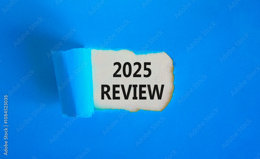 Planning 2025 review new year symbol. Concept words 2025 Review on beautiful white paper. Beautiful blue paper background. Business 2025 review new year concept. Copy space. Planning 2025 review new year symbol. Concept words 2025 Review on beautiful white paper. Beautiful blue paper background. Business 2025 review new year concept. Copy space.