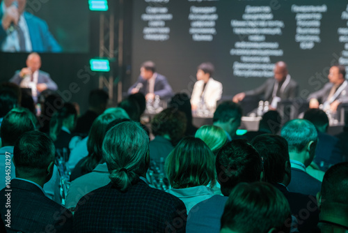 Canvastavla Audience attending business conference panel discussion with professionals on stage