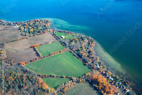 Obraz na płótnie Parcels of land alongside a lake beach clearly defined from an aerial view