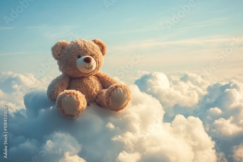 A plush bear sits contently on a fluffy cloud against a bright blue sky in da...