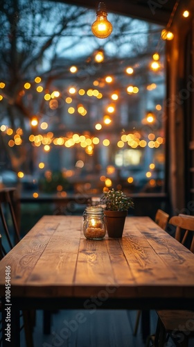 Outdoor dining area with wooden tables and twinkling lights in a cozy setting...