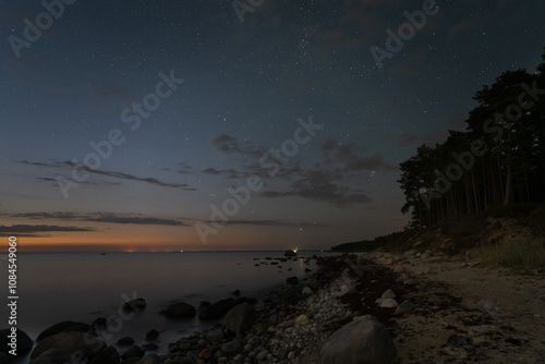 Fototapeta Naklejka Na Ścianę i Meble -  Night landscape, sandy shore of Pedassaar island, starry sky, milky way and gulf of Finland.