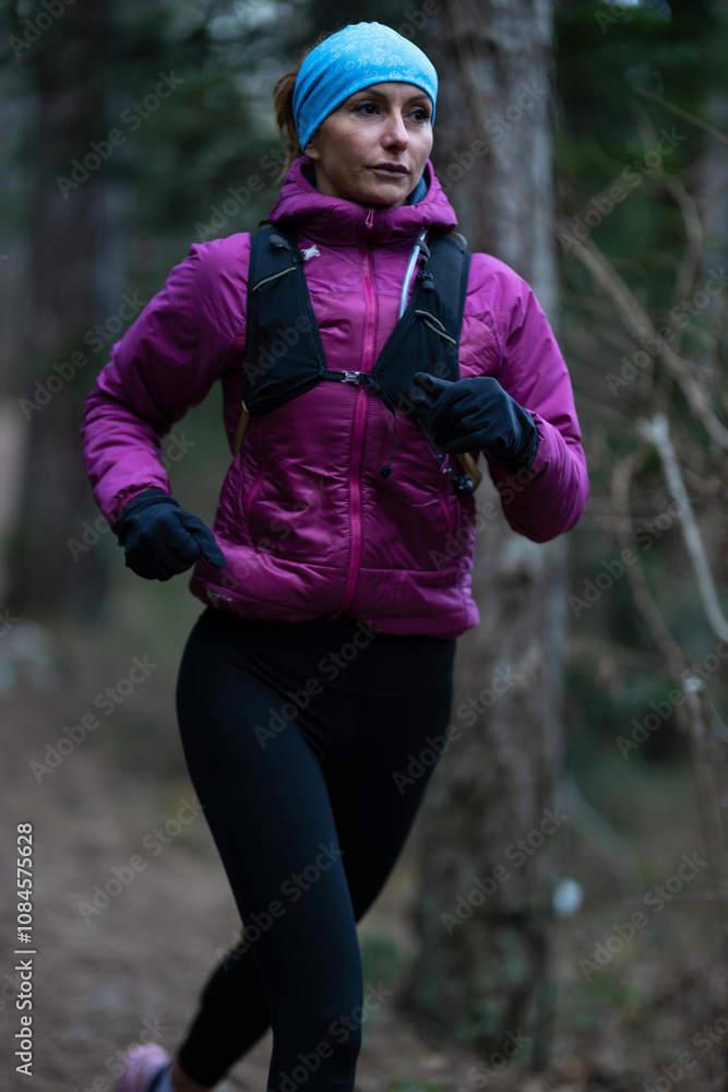 Fototapeta premium trail running woman athlete training for ultra-marathon race in a mountain