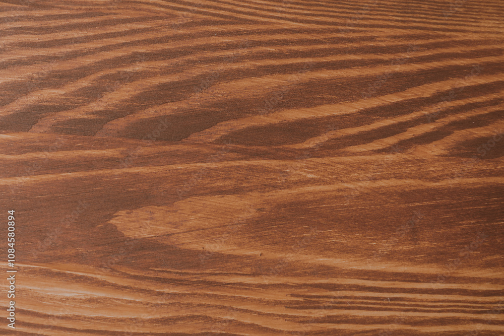 Applying walnut wood stain. Texture of wooden surface as background, top view Applying walnut wood stain. Texture of wooden surface as background, top view