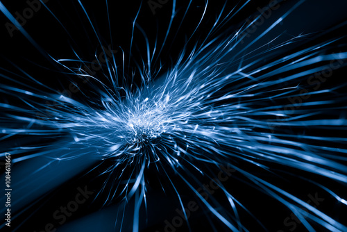 blue sparks from the grinder glowing in the dark