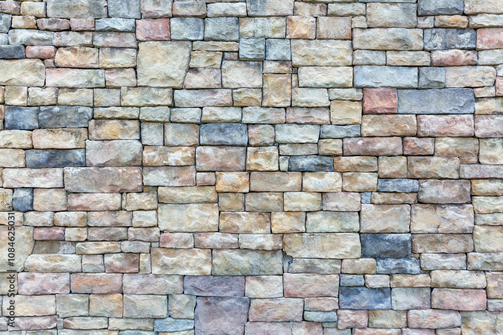 Obraz premium Vibrant Multicolored Brick Wall with Artistic Patterns
