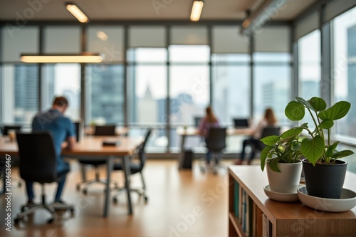 A group of individuals sitting together at a table in a bright room filled with greenery