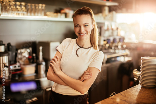 Portrait of a young female barista working at a cafe