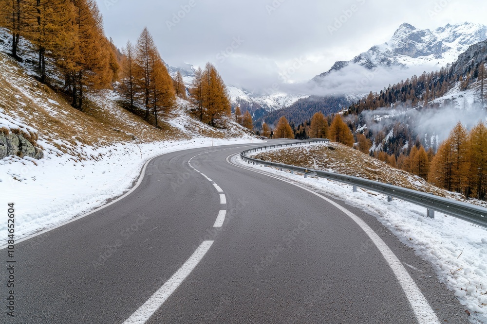 A snow covered road with a white line down the middle A snow covered road with a white line down the middle