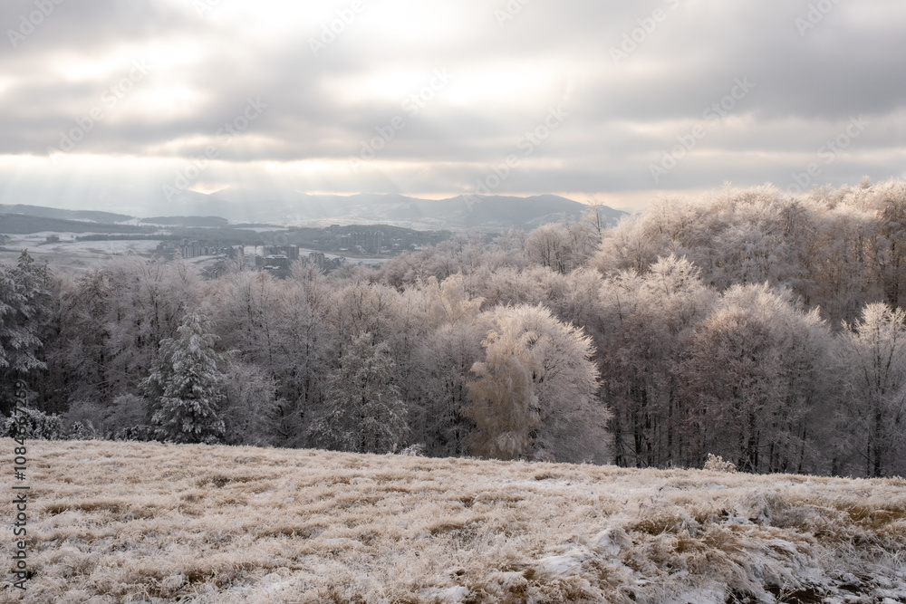 Sunset and first snow in a mountains in late autumn Sunset and first snow in a mountains in late autumn