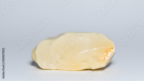 raw nepheline syenite stone on white photo