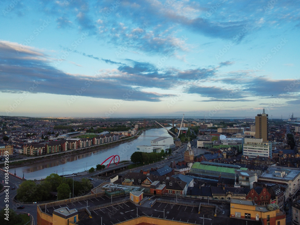 Fototapeta premium High Angle View of Newport City on River Usk Wales, United Kingdom During Sunset. Aerial Footage Was Captured with Drone's Camera on May 27th, 2024