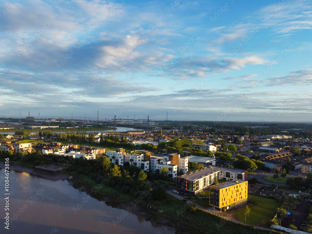 Naklejka premium High Angle View of Newport City on River Usk Wales, United Kingdom During Sunset. Aerial Footage Was Captured with Drone's Camera on May 27th, 2024