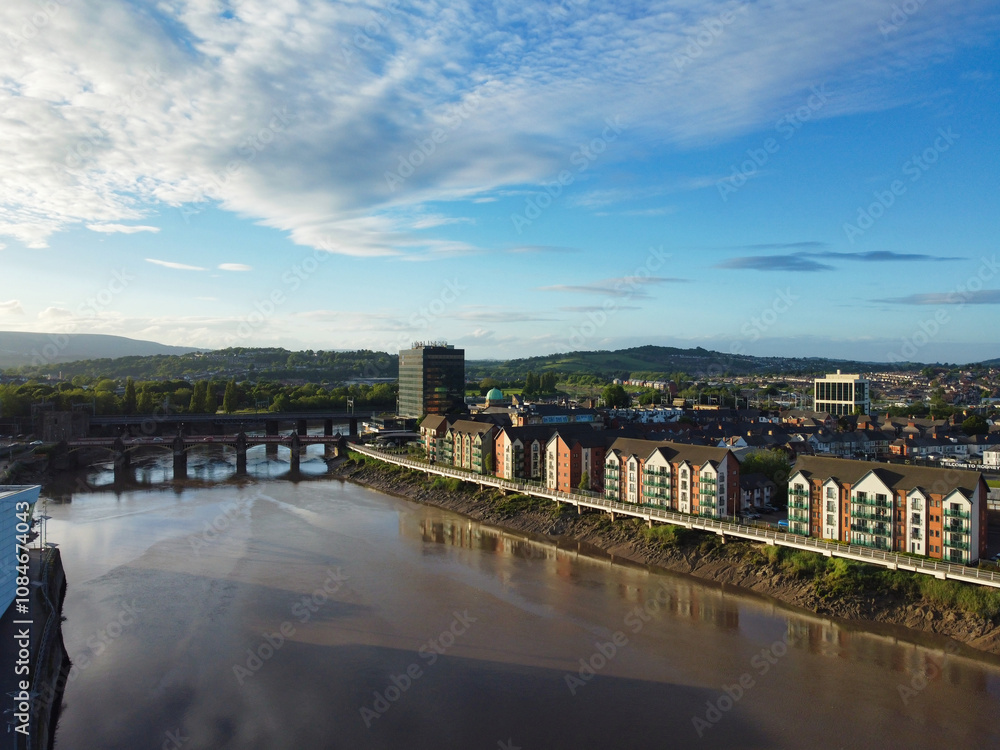 Obraz premium High Angle View of Newport City on River Usk Wales, United Kingdom During Sunset. Aerial Footage Was Captured with Drone's Camera on May 27th, 2024