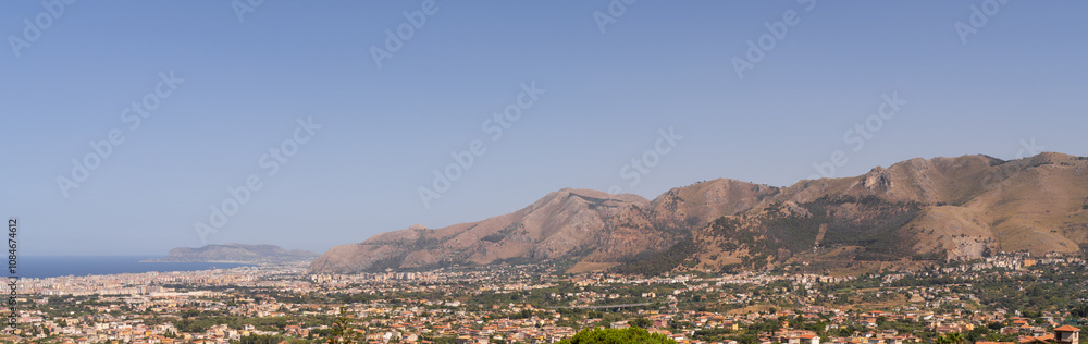 Obraz premium Panoramic view of Palermo city and mountains from Monreale town, Sicily, Italy, vast coastal cityscape framed by mountains in background, coastline and urban landscape
