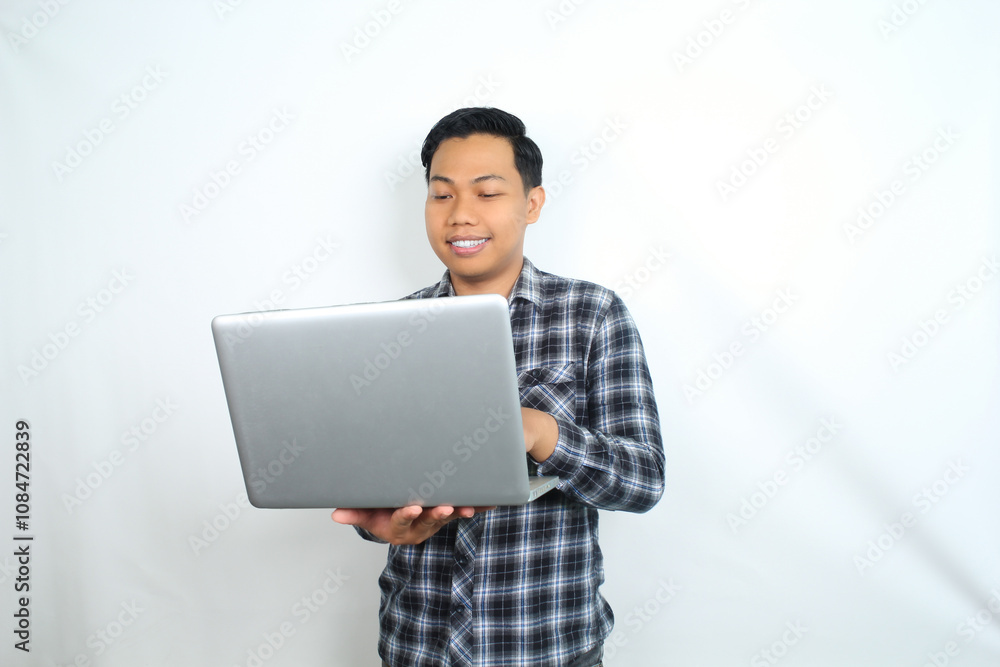 smiling asian man using laptop isolated on white background wearing plaid shirt smiling asian man using laptop isolated on white background wearing plaid shirt