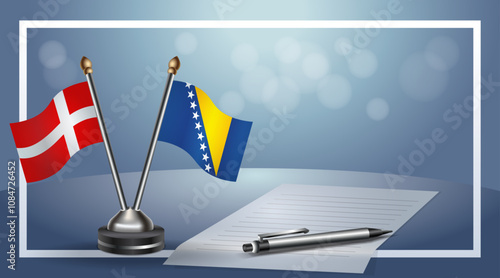 Denmark and Bosnia and Herzegovina National flags on small table with bokeh background, cooperative relationship