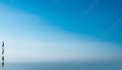 Serene view of a clear sky transitioning from a deep blue to a soft white horizon. Perfect for backgrounds or design elements.