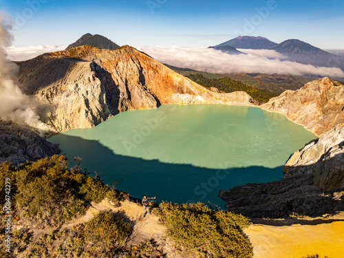 Aerial view Kawah Ijen volcano with turquoise sulfur water lake at sunrise.Amazing nature landscape view at East Java, Indonesia. Natural landscape background