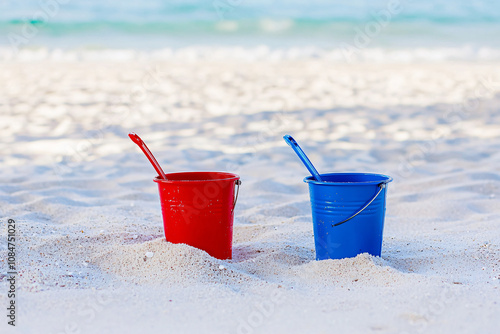 red and blue beach buckets, castle sand construction, fun