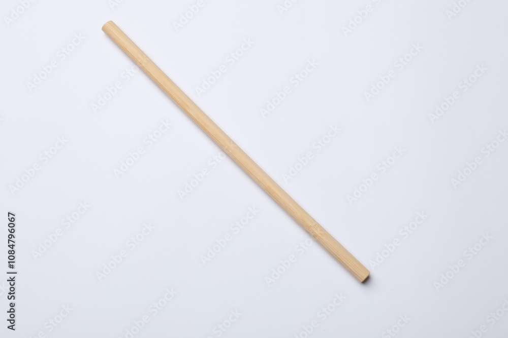 One bamboo drinking straw on white background, top view One bamboo drinking straw on white background, top view