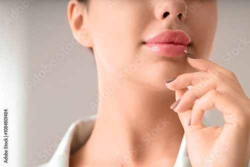 Young woman with soft lips ...