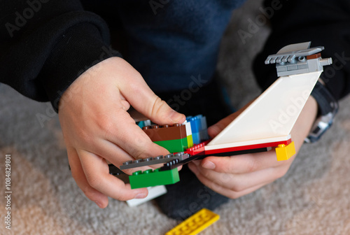 hands playing with blocks