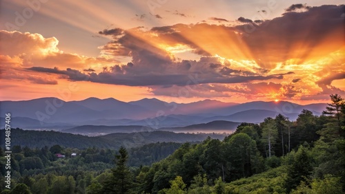 A breathtaking sunset over rolling hills and distant mountains, showcasing the vibrant colors of the sky and the serene beauty of nature.