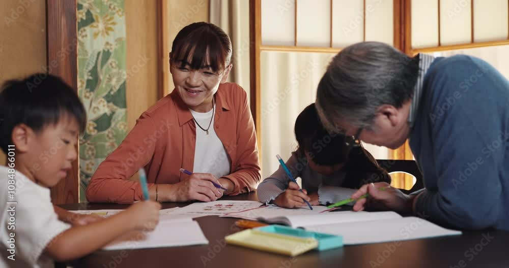 Home, grandparents and helping children with homework by table for learning support, education or development. Japanese family, senior people and students with drawing in book for creative assessment Home, grandparents and helping children with homework by table for learning support, education or development. Japanese family, senior people and students with drawing in book for creative assessment