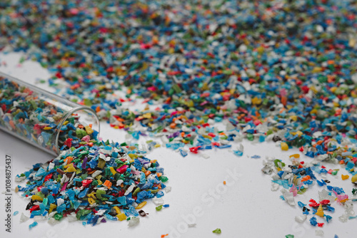 Hands hold clear white plastic pellets, raw materials for various manufacturing processes. These pellets are widely used in industries to produce products like packaging, bottles, and equipment parts.