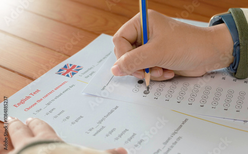 English test and bubble answer sheet on table in class