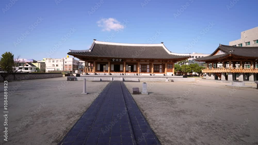 a traditional Korean pavilion with a tiled roof and wooden beams, situated in a courtyard with a stone pathway leading to its entrance, surrounded by a blend of traditional and modern architecture a traditional Korean pavilion with a tiled roof and wooden beams, situated in a courtyard with a stone pathway leading to its entrance, surrounded by a blend of traditional and modern architecture