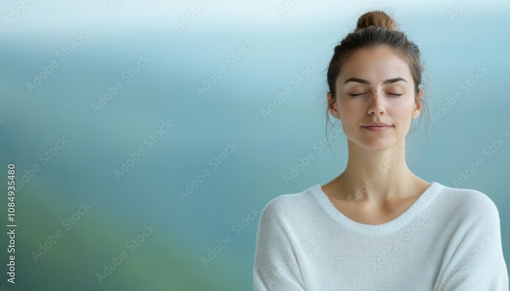 Young woman practicing mindfulness in serene setting with gentle background blur