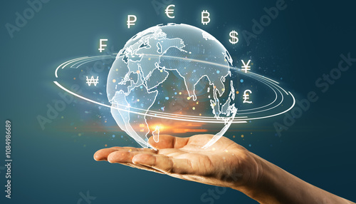 Wallpaper Mural Hand holding a digital globe with currency symbols surrounding it on a dark background. Torontodigital.ca
