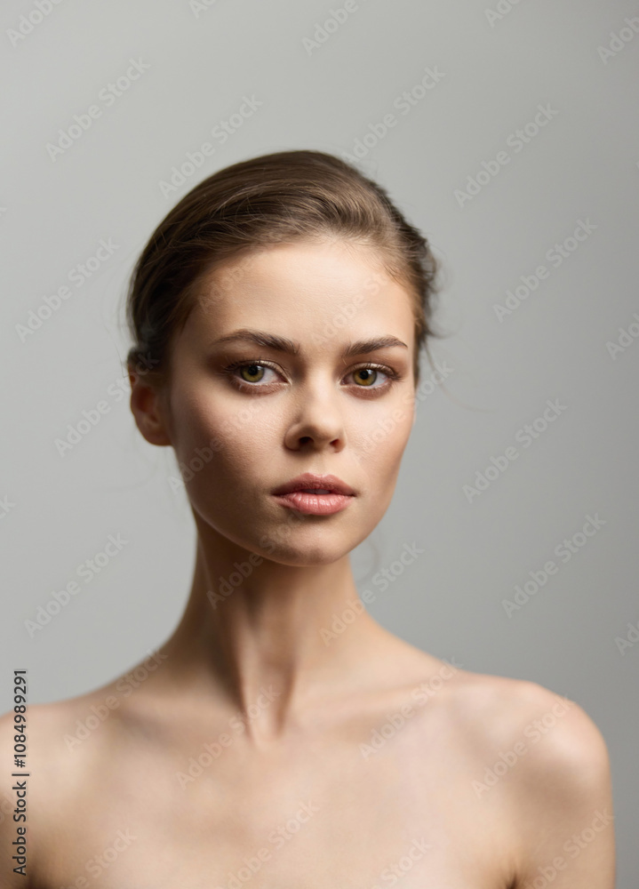 Portrait of a serene young woman with natural beauty, soft lighting highlighting her features, against a neutral background. Concept of elegance and simplicity. Portrait of a serene young woman with natural beauty, soft lighting highlighting her features, against a neutral background. Concept of elegance and simplicity.
