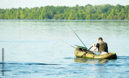 fishermen catch fish with a rubber boat photo