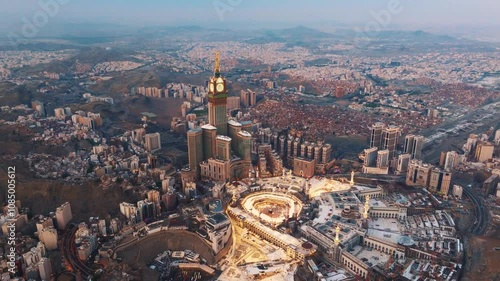 Aerial view of the Grand Mosque with the Kaaba, Islam’s holiest site, and the Abraj Al-Bait Clock Tower illuminated by early morning sunlight in the holy city of Mecca